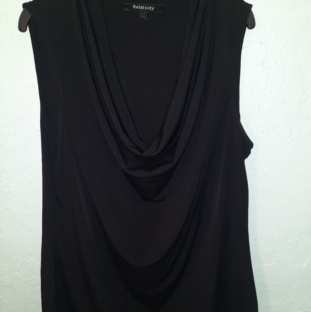 Sleeveless drape neck top.